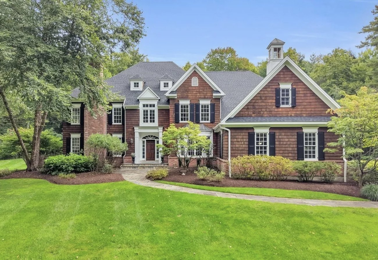 Custom built four bedroom home with cedar shingle and brick exterior and a cupola in Canton CT, last asking $1.08 million